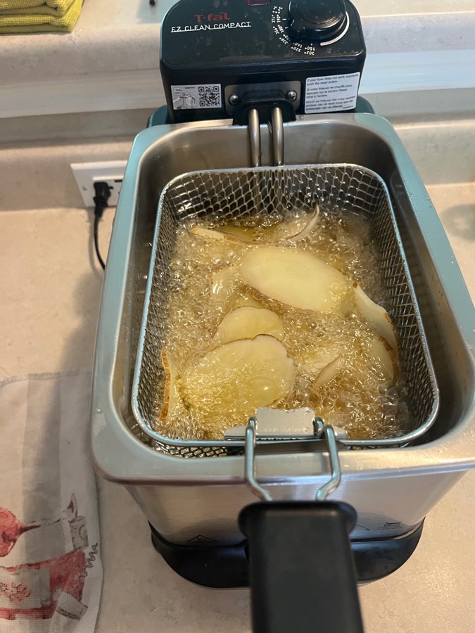 See the chips happily frying? When the bubbles stop (the water has boiled out of the chips), they’re done.