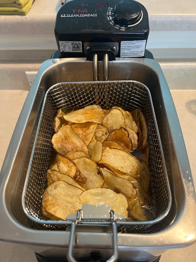 Still in the oil, these are ready to dump in a bowl, season and toss right away.